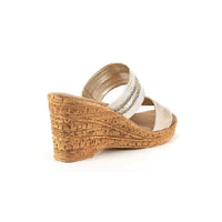 Two strap high heel slide in platinum with cork wedge.