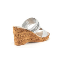 Two strap high heel slide in silver with cork wedge.