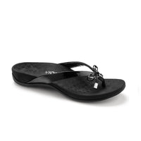 Black flip flop with microfiber lining and bow detail.